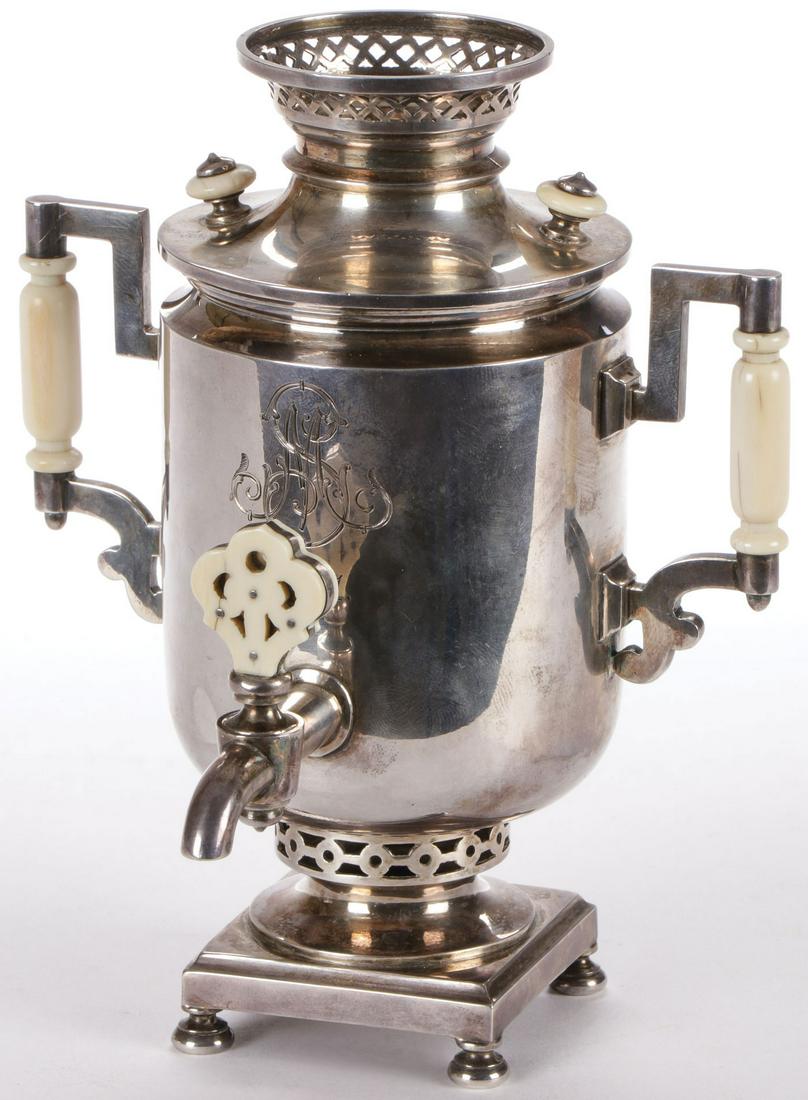 RUSSIAN SILVER MINIATURE SAMOVAR, GRACHEV: RUSSIAN SILVER MINIATURE SAMOVAR, GRACHEV. Of traditional form resting on four bun feet, with ornate side handles, lid and spigot, each mounted on a natural material, and on the face an ornately chase