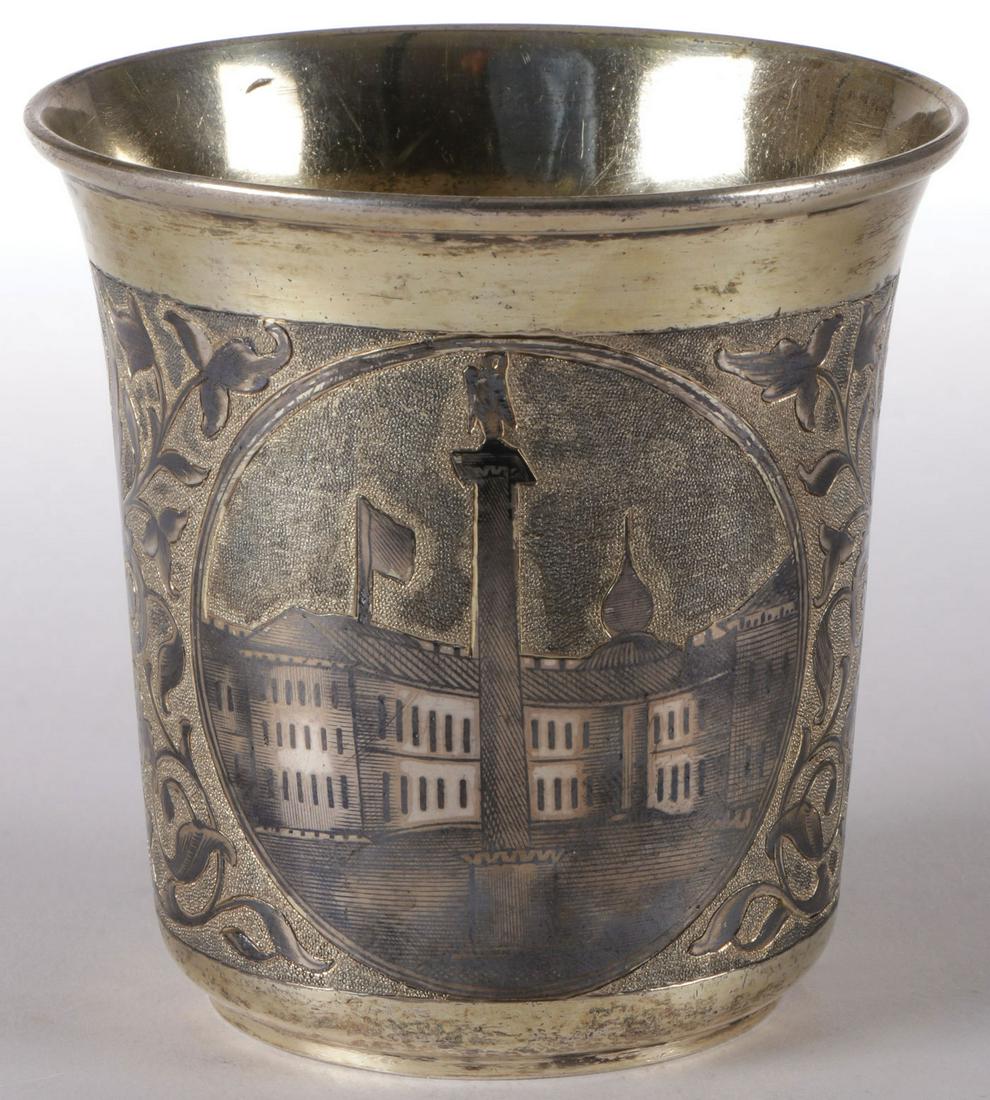 RUSSIAN SILVER GILT & NIELLO BEAKER 1841: RUSSIAN SILVER GILT & NIELLO BEAKER 1841. Resting on slightly raised ring foot, of cylindrical form, with flared rim, the sides ornately banded in nielloed scrolling foliage on a stippled gilt ground 