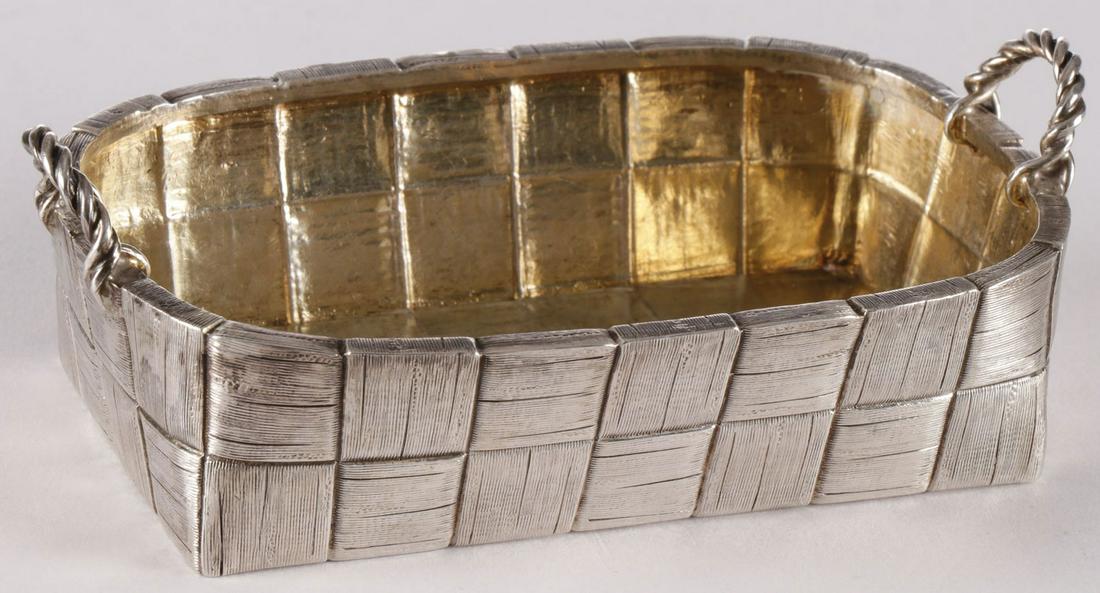 RUSSIAN SILVER TROMPE L'OEIL BASKET: RUSSIAN SILVER TROMPE L'OEIL BASKET. Comprising a finely crafted silver gilt, probably a candy dish, rendered as a woven birch bark basket with rope handles, hallmarked St. Petersburg, dated 1882 and