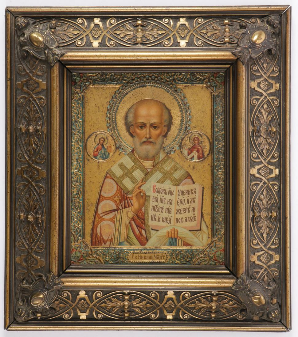RUSSIAN ICON OF ST. NICHOLAS, C. 1900: RUSSIAN ICON OF ST. NICHOLAS, C. 1900. Comprising a finely crafted icon of Saint Nicholas executed in color lithography on relief molded tin ground and contained in an attractive frame of the same per