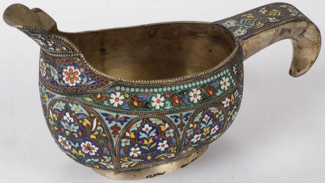 A LARGE RUSSIAN STYLE ENAMELED KOVSH: A LARGE RUSSIAN STYLE ENAMELED KOVSH. Of traditional form with hook handle and extended prow, the body overall in cloisonnéd enamel flower heads and beading, resting on slightly flared ring foot with