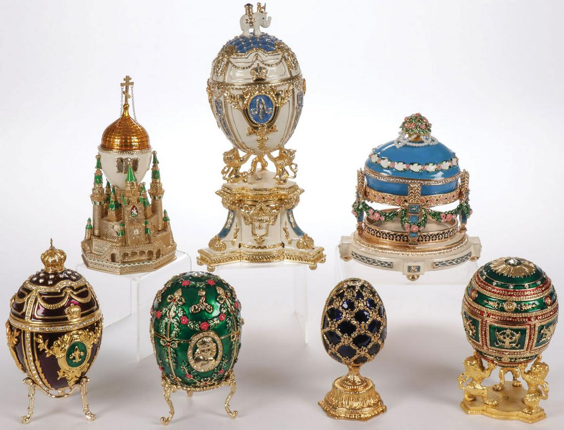 SEVEN FABERGÉ STYLE PRESENTATION EGGS: SEVEN FABERGÉ STYLE PRESENTATION EGGS. Many based on famous known Imperial presentation eggs, some opening to reveal a surprise, including a fold-out picture frame, and two with music box bases. Grea