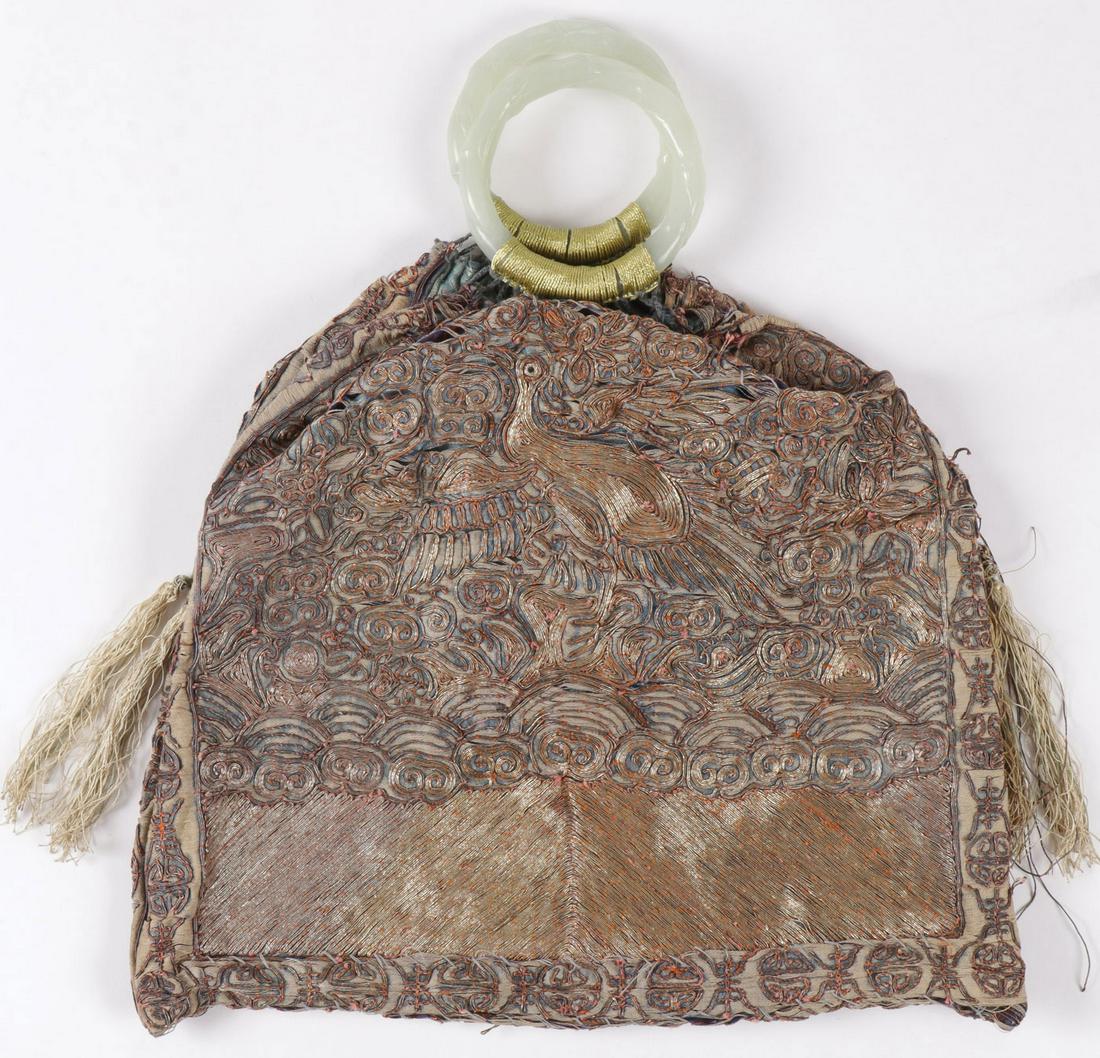 CHINESE RANK BADGE BAG, 19TH C: CHINESE RANK BADGE BAG, 19TH C. Comprising a silk embroidered rank badge hand bag with phoenix amongst the clouds, and the shoulders with silk tassels and two jade bamboo carved ring handles. Height 1