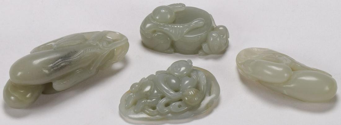CHINESE CARVED JADE PENDANTS: CHINESE CARVED JADE PENDANTS. Comprising four Chinese antique individually carved jade figural pendants, including two clusters of eggplants, a child and dog around a drum (pierced for suspension), an
