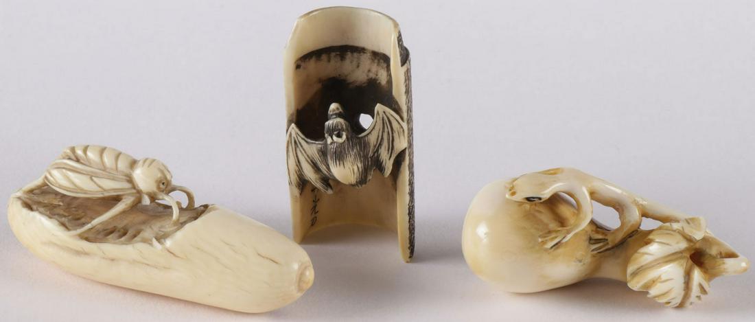 THREE JAPANESE CARVED NETSUKES, MEIJI: THREE JAPANESE CARVED NETSUKES, MEIJI. Each finely carved depicting various subjects, including a bee feeding on a plum, a bat climbing a bamboo shoot, and a small lizard atop a plum. Each signed and 