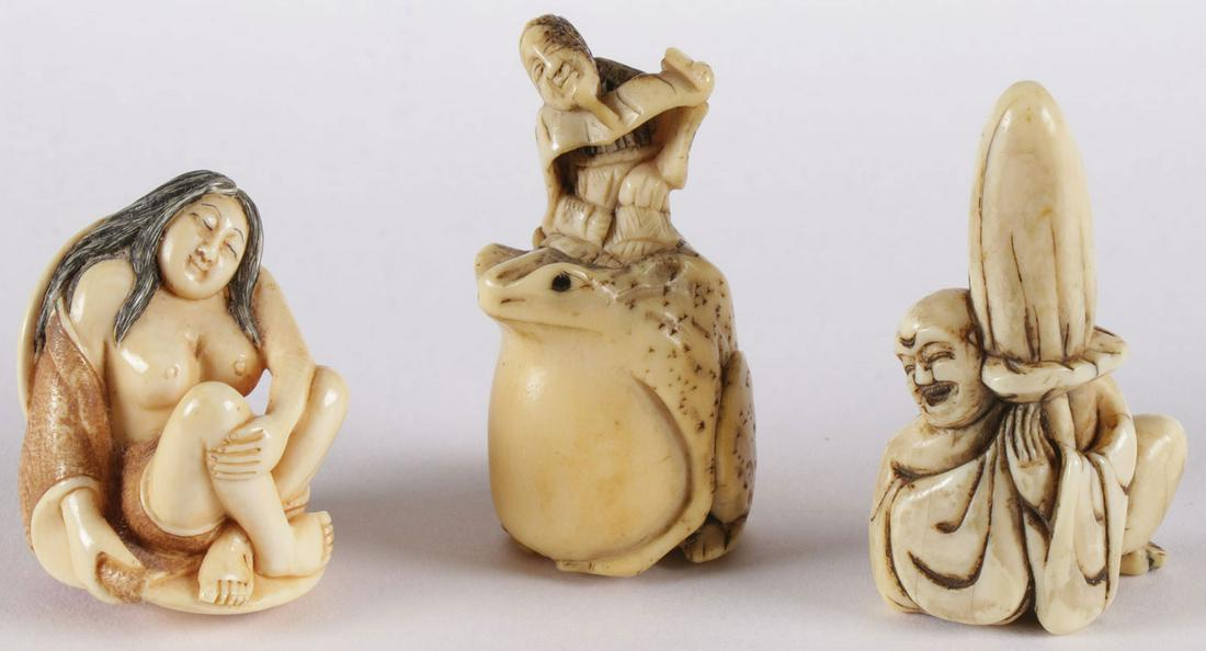 JAPANESE CARVED NETSUKES, MEIJI: JAPANESE CARVED NETSUKES, MEIJI. Comprising three carved netsukes, including a carved figure of a seated topless woman, resting within a clamshell, signed, a carved bone netsuke of a figure atop a toa