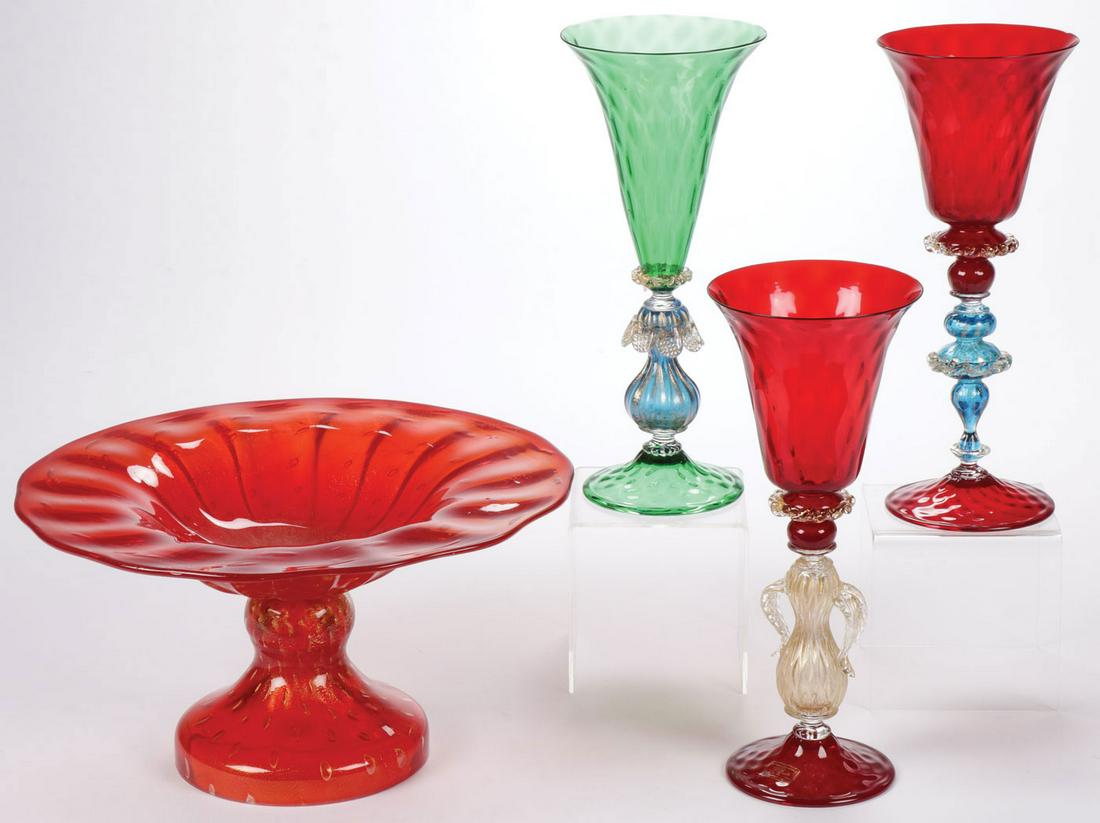 FOUR PIECES OF MURANO GLASS: FOUR PIECES OF MURANO GLASS. Comprising a red and gilt fleck decorated swirl compote and three footed goblets. Each goblet with the D'Este Murano Studio label. The goblets each 10.75 inches (27 cm). T