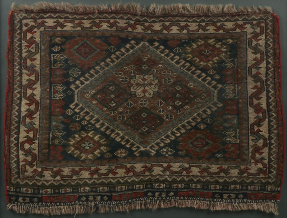 TWO MIDDLE EASTERN CARPETS: TWO MIDDLE EASTERN CARPETS. Comprising a tribal bagface mounted in a gilded and glazed frame (20 inches x 25.5 inches). Together with a Turkeman circa 1950 (63.5 inches x 43.25 inches). SHIPPING NOTIC