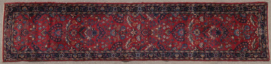 A PAIR OF MIDDLE EASTERN RUNNERS: A PAIR OF MIDDLE EASTERN RUNNERS. A sarouk runner c. 1920, 134 inches x 30.5 inches, together with a Hamedan runner circa 1940, 105.25 inches x 28.5 inches. SHIPPING NOTICE: Jackson's is your sole and