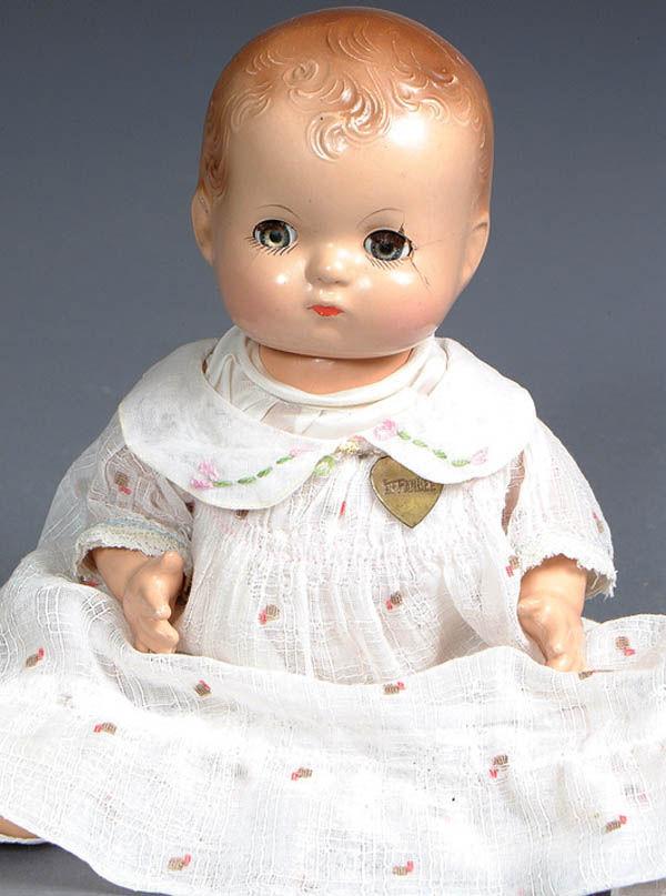 AN EFFANBEE PATSY BABY, some compo wear and crack: AN EFFANBEE PATSY BABY, some compo wear and cracking. Height 11 inches. Estimate $50-$75