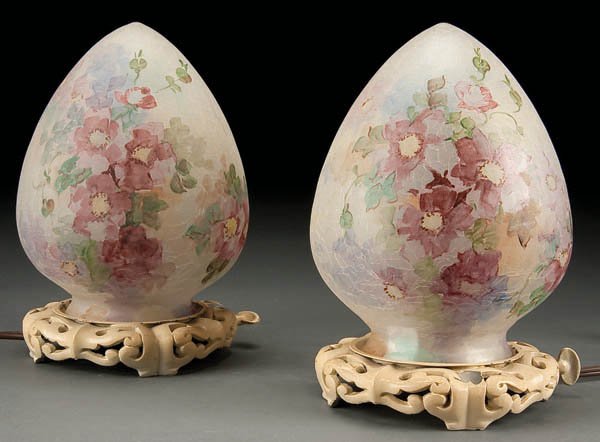 A PAIR OF HANDEL BOUDOIR LAMPS early 20th century: A PAIR OF HANDEL BOUDOIR LAMPS early 20th century, reverse printed on teardrop form metal bases. Height 7.75 inches. Estimate $800-$1,200