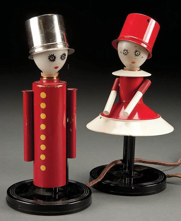 A CHASE COLONEL AND COLONEL'S LADY ART DECO FIGUR: A CHASE COLONEL AND COLONEL'S LADY ART DECO FIGURAL LAMPS, early 20th century, designed by LURELLE GUILD, each with red, white, and black enameled details, frosted glass light bulb 'faces' with painte