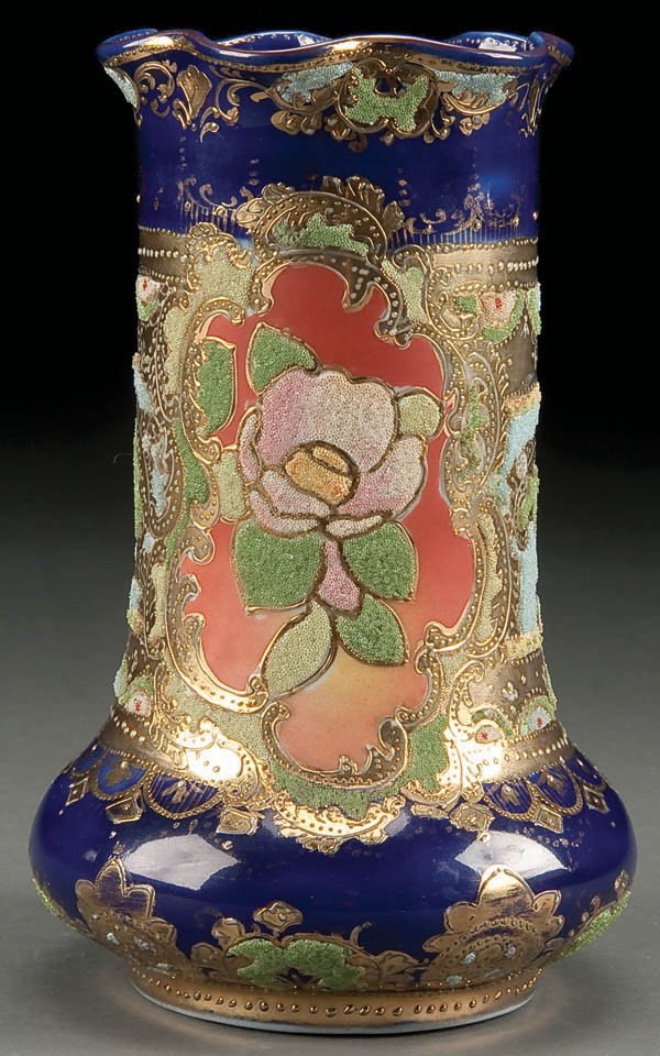 A HAND PAINTED NIPPON CORALENE VASE, with stylize: A HAND PAINTED NIPPON CORALENE VASE, with stylized flowers and gold scrolls. Magenta US Patent mark. Height 7.5 inches. Estimate $400-$600