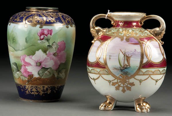 A PAIR OF FINE HAND PAINTED NIPPON PORCELAIN VASE: A PAIR OF FINE HAND PAINTED NIPPON PORCELAIN VASES early 20th century, the first with Mt. Fuji harbor scene and jeweled swags raised on lion paw feet. The second with pink wild rose decoration. Blue M