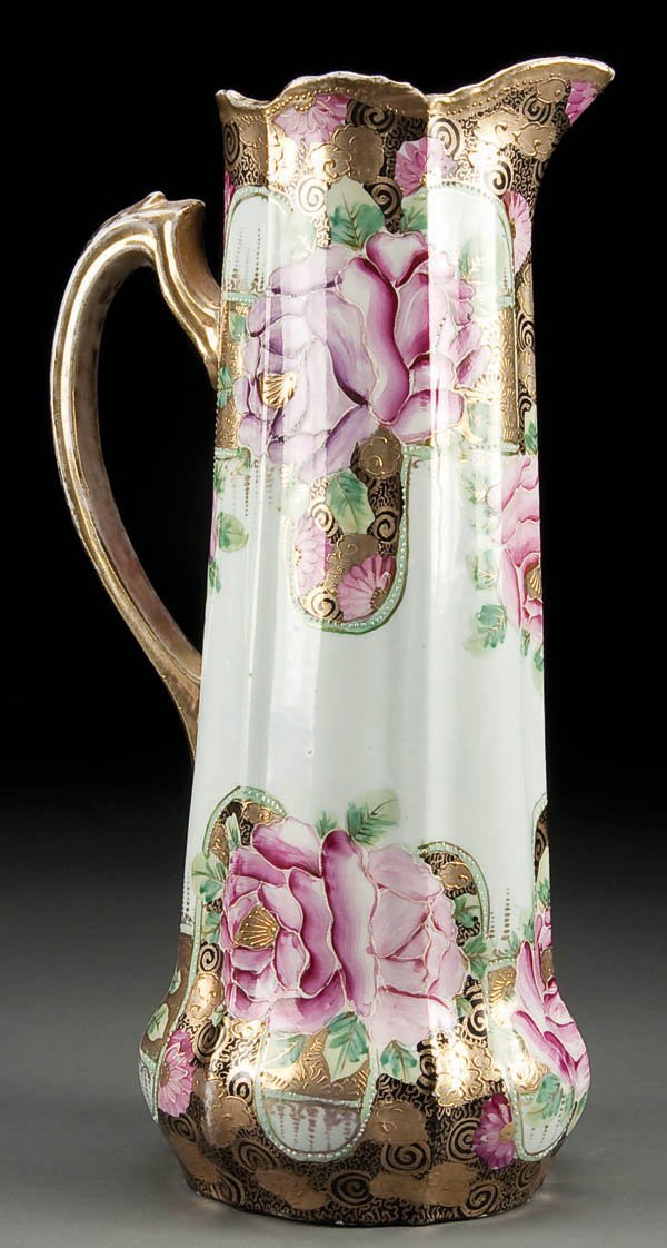 A HAND PAINTED NIPPON TANKARD, with pink roses an: A HAND PAINTED NIPPON TANKARD, with pink roses and gold decoration. Unmarked. Height 14 inches. Estimate $200-$300