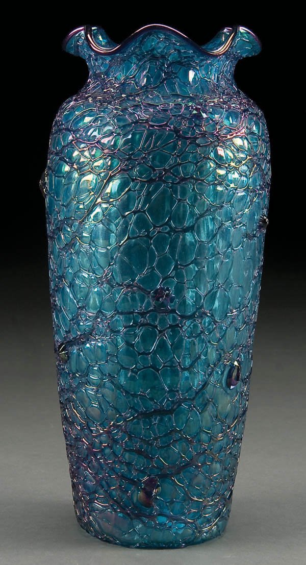 A CZECH (LOETZ) 10.5 INCH BLUE IRIDIZED AND THREA: A CZECH (LOETZ) 10.5 INCH BLUE IRIDIZED AND THREADED ART GLASS VASE, early 20th century with oval Czech acid stamp. Height 10.5 inches. Estimate $300-$500
