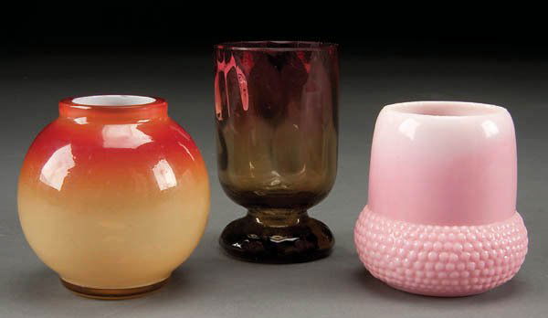 THREE VICTORIAN ART GLASS TOOTHPICK HOLDERS consi: THREE VICTORIAN ART GLASS TOOTHPICK HOLDERS consisting of an amberina with pedestal base, a peachblow acorn shape, and a Webb glossy peachblow (reduced rim) Height 2.5-3 inches. Estimate $100-$150