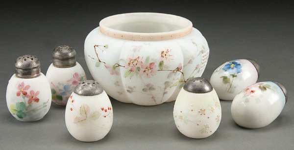 A MT. WASHINGTON ART GLASS GROUP, late 19th centu: A MT. WASHINGTON ART GLASS GROUP, late 19th century, comprising a melon rib bowl with painted florals, two enameled egg shape shakers, two decorated flat egg shakers and two floral spray shakers. Diam
