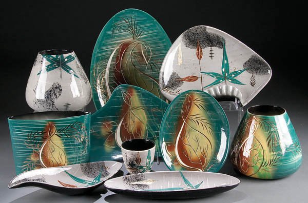 A MARC BELLAIRE ART POTTERY GROUP, mid 20th centu: A MARC BELLAIRE ART POTTERY GROUP, mid 20th century, ten pieces in various free form shapes in stylized floral patterns, the largest 17.5 inches. Estimate $150-$250