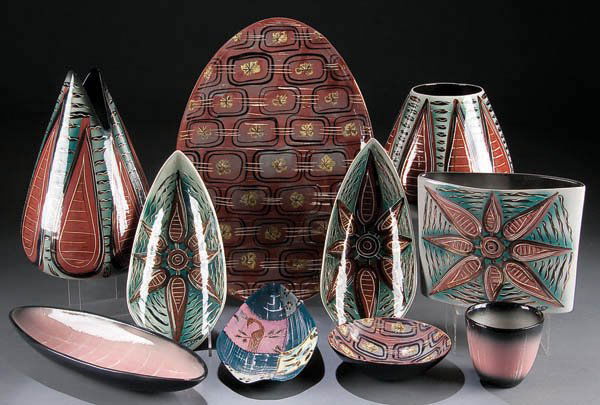 A MARC BELLAIRE ART POTTERY GROUP, mid 20th centu: A MARC BELLAIRE ART POTTERY GROUP, mid 20th century, assorted free form shapes, vases and trays in various stylized patterns, up to 17.5 inches. Estimate $150-$250
