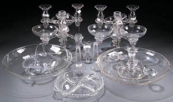 A PAIR OF CAMBRIDGE CRYSTAL TIERED CANDLEHOLDER: A PAIR OF CAMBRIDGE CRYSTAL TIERED CANDLEHOLDER FLOWER EPERGNES, mid 20th century, diameter 13 inches. Together with a Candlewick handled basket and four part relish. Estimate $50-$100