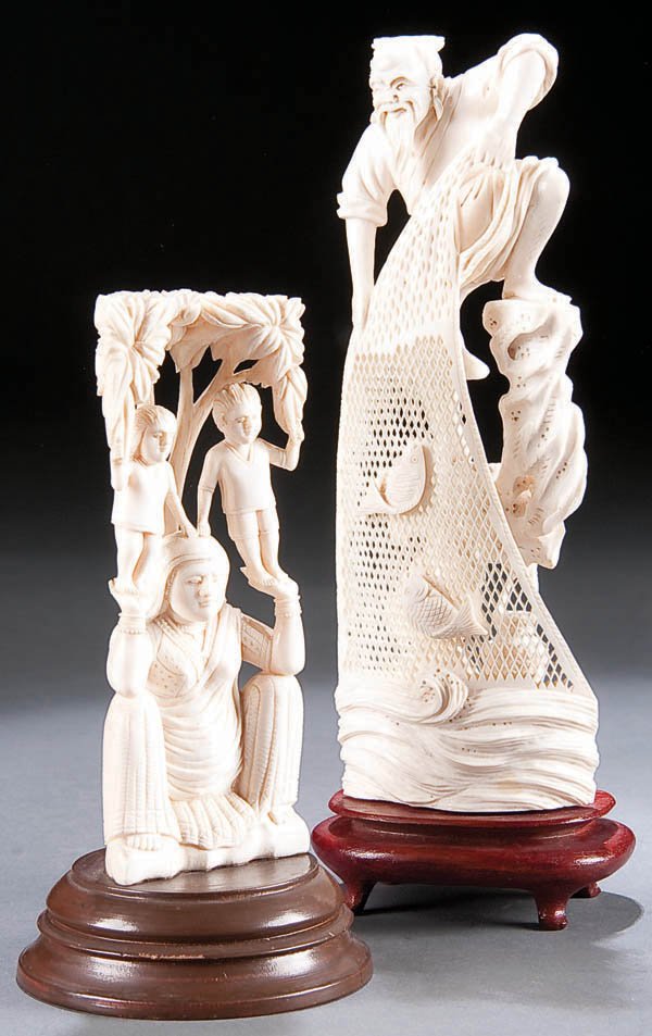 A PAIR OF ORIENTAL CARVED IVORY FIGURES, 20th c: A PAIR OF ORIENTAL CARVED IVORY FIGURES, 20th century, of a Buddhist figure and a fisherman retrieving a net. Height 6 inches x 8.25 inches. Estimate $400-$700