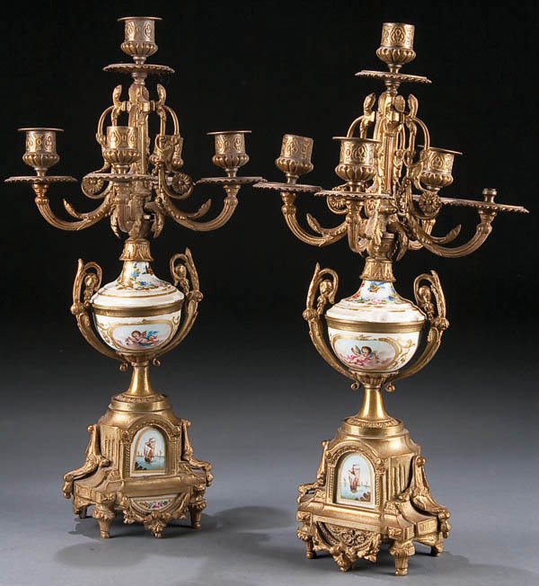A PAIR OF NAPOLEON III ORMOLU AND PORCELAIN CANDE: A PAIR OF NAPOLEON III ORMOLU AND PORCELAIN CANDELEBRA, circa 1900, with painted floral and nautical themes, some losses, height 17.5 inches. Estimate $100-$200