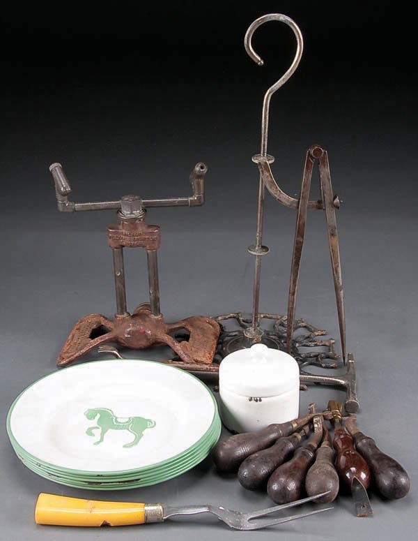 A PRIMITIVE KITCHEN UTENSIL AND HAND TOOL GROUP,: A PRIMITIVE KITCHEN UTENSIL AND HAND TOOL GROUP, late 19th- early 20th century, consisting of a seven piece Bakelight kitchen utensil set, enameled kitchen dinnerware, an iron pea sheller, enameled nu