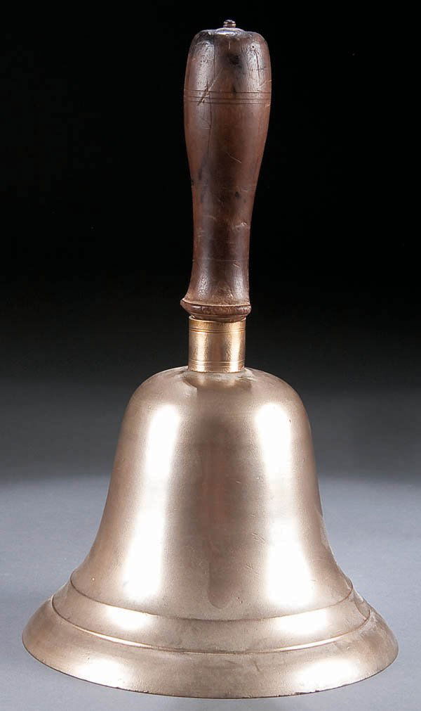 A LARGE BRASS SCHOOL BELL circa 1900, with turned: A LARGE BRASS SCHOOL BELL circa 1900, with turned wood handle. Height 11 inches. Estimate $50-$100