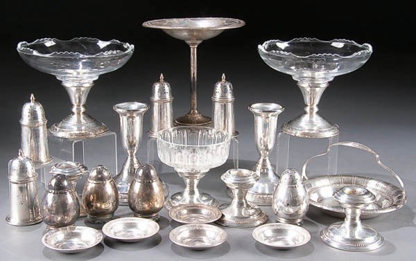 A VINTAGE STERLING TABLEWARE GROUP, early to mid : A VINTAGE STERLING TABLEWARE GROUP, early to mid 20th century, comprising a 6 inch compote and 5.5 inch basket, six candleholders, two glass compotes with silver bases, eight table shakers and five sa