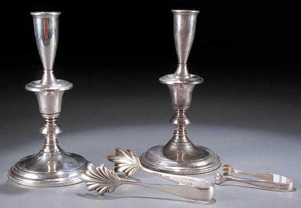 A PAIR OF STERLING CANDLE STICKS early 20th centu: A PAIR OF STERLING CANDLE STICKS early 20th century, Height 8.5 inches. Together with a Kirk & Son sterling tongs (length 6 inches) and plated sugar tongs. Estimate $75-$125