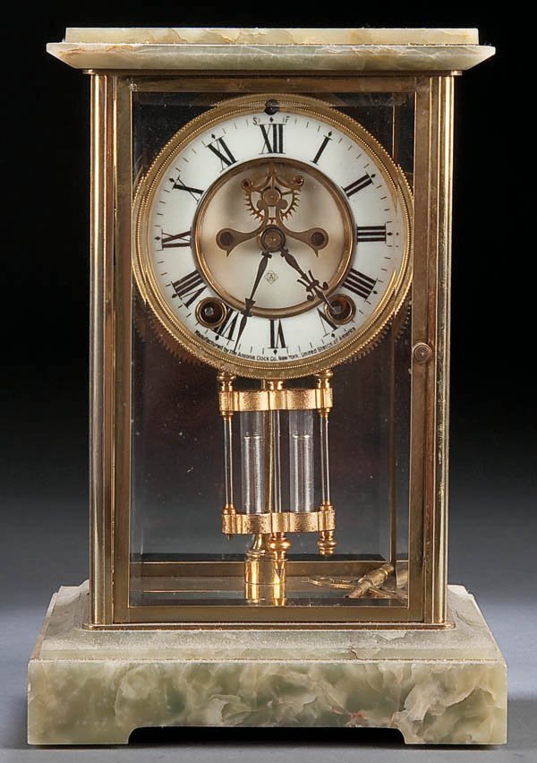 AN ANSONIA CRYSTAL REGULATOR CLOCK circa 1900, wi: AN ANSONIA CRYSTAL REGULATOR CLOCK circa 1900, with onyx top and base. Height 11 inches. Estimate $150-$250