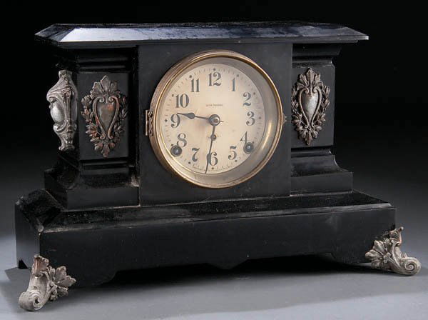 A SETH THOMAS METAL CASE MANTLE CLOCK, circa 20th: A SETH THOMAS METAL CASE MANTLE CLOCK, circa 20th century, with molded applied decoration, height 10.5 inches. Estimate $100-$200