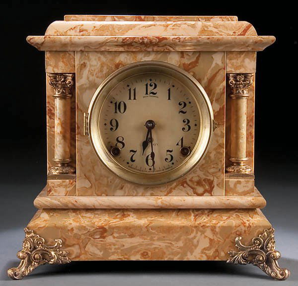 A SETH THOMAS MANTLE CLOCK, circa 1890, with marb: A SETH THOMAS MANTLE CLOCK, circa 1890, with marbleized decoration and original label on verso, height 11.75 inches. Estimate $200-$400