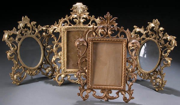 FOUR VICTORIAN CAST IRON ROCOCO STYLE PICTURE FRA: FOUR VICTORIAN CAST IRON ROCOCO STYLE PICTURE FRAMES, circa 1900, each with painted gilt finish, up to 12 inches tall. Estimate $100-$200