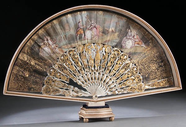 A VERY FINE FRENCH 18TH CENTURY SCENIC PAINTED FA: A VERY FINE FRENCH 18TH CENTURY SCENIC PAINTED FAN with carved and gilt mother of pearl sticks containing a painted scene on obverse and reverse of various romantic garden and courting scenes, display