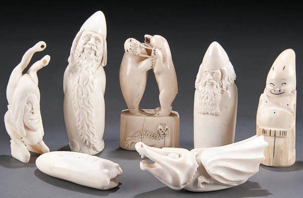 A GROUP OF CARVED IVORY INUIT OR ALASKAN FIGURES: A GROUP OF CARVED IVORY INUIT OR ALASKAN FIGURES circa 1950- including a polar bear and walrus fighting, a pair of gnomes and three other figures together with a bone carved distorted figure. From 3 i