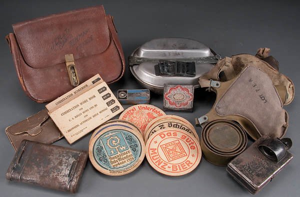 A GERMAN & U.S. WWII 14 PIECE MISCELLANEOUS GROUP: A GERMAN & U.S. WWII 14 PIECE MISCELLANEOUS GROUP LOT including a US WWII mess kit ''Leyse 1945'', two US EM belt buckles, German pigskin satchel w/ GI trench art, German K-98 cleaning kit with conten