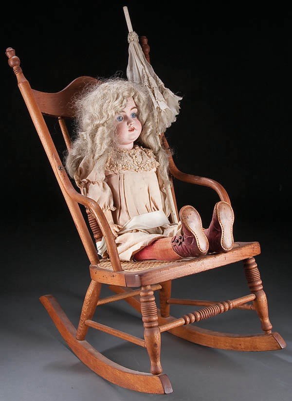 A VERY FINE J.D. KESTNER BISQUE DOLL, circa 1900,: A VERY FINE J.D. KESTNER BISQUE DOLL, circa 1900, ''Georgia Rose'' blue sleep eyes with jointed composition body, clothing, shoes, rocker purchased in 1900 (wig replaced 1960), height 26 inches, toget