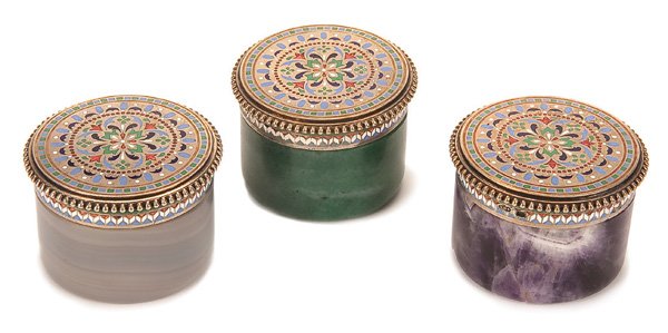 A GROUP OF RUSSIAN SILVER-GILT AND ENAMEL DRESSER : A GROUP OF THREE RUSSIAN SILVER GILT AND CHAMPLEVE ENAMEL DRESSER JAR LIDS, ST. PETERSBURG, CIRCA 1880 Each lid with a beaded rim and enameled with a champleve rosette medallion. Set on probably later