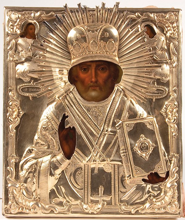A RUSSIAN ICON OF ST. NICHOLAS, MOSCOW 1849. : A RUSSIAN ICON OF ST. NICHOLAS, MOSCOW 1849. Naturalistically painted and overlaid with an ornate gilded silver repousee and chased riza with applied halo. Hallmarked Moscow, dated 1849 and with Cyril