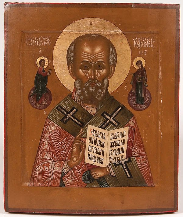 A RUSSIAN ICON OF ST. NICHOLAS, CIRCA 1890. : A RUSSIAN ICON OF ST. NICHOLAS, CIRCA 1890. Nicholas delivers a blessing with his right hand and holds an open book of Gospels to the Sermon on the Mount. Flanking his head are images of Christ (left)