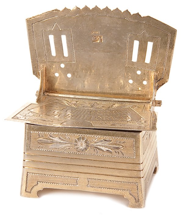 A RUSSIAN SILVER ENGRAVED SALT THRONE, MOSCOW: A RUSSIAN SILVER ENGRAVED SALT THRONE, MOSCOW 1879. The hinged lid (seat) engraved in Cyrillic and opens to reveal a large gilded reservoir. Underside of lid engraved with a hen. Hallmarked Moscow, da