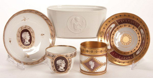 A ROYAL VIENNA SEVRES AND KPM PORCELAIN GROUP: A ROYAL VIENNA SEVRES AND KPM PORCELAIN GROUP, 19TH CENTURY. Comprising a hand painted Sevres and Royal Vienna cup and saucer, and a KPM jardiniere with bisque medallion of Cupid. Length 6.25 inches (