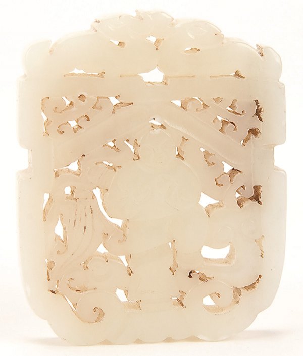 A CHINESE CARVED WHITE JADE PENDANT, QING DYNASTY: A CHINESE CARVED WHITE JADE PENDANT, QING DYNASTY. With carved and pierced design of a boy and foliate scrolls in white mutton fat nephrite. Height 2.5 inches (6.5 cm). Estimate $300-$500 Euro 200-400