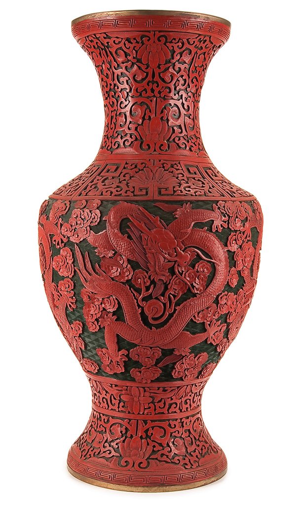AN IMPRESSIVE CHINESE CARVED CINNABAR FLOOR VASE: AN IMPRESSIVE CHINESE CARVED CINNABAR FLOOR VASE LATE QING/REPUBLIC PERIOD. With finely carved and detailed scene depicting five toed scrolling dragons. Height 25.5 inches (64.5 cm). Estimate $600-$90