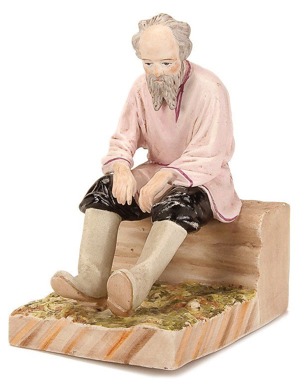 A RUSSIAN-STYLE PORCELAIN FIGURE: A HAND PAINTED BISQUE PORCELAIN FIGURE OF A SEATED ELDERLY PEASANT MAN, SECOND HALF 20TH CENTURY. With spurious red Gardner factory stamp. Height 6 inches (15.3 cm). Estimate $400-$700 Euro 300-500
