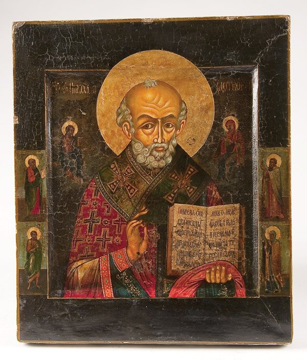 A RUSSIAN ICON OF SAINT NICHOLAS: A RUSSIAN ICON OF SAINT NICHOLAS, 19TH/20TH CENTURY. The border with four family saints. 13.25 inches x 11.25 inches (33.7 x 28.8 cm). Estimate $200-$300 Euro 100-200
