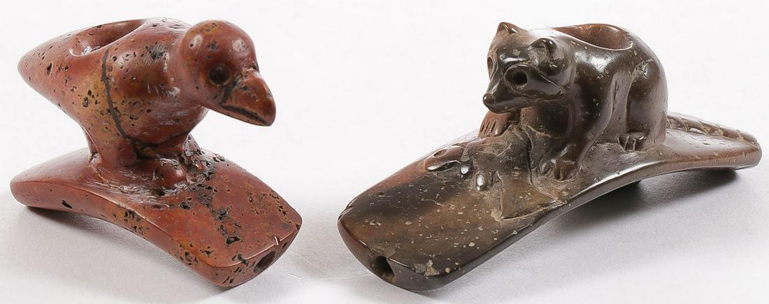 2 HOPEWELL ANIMAL PIPES: 2 HOPEWELL ANIMAL PIPES. Comprising two finely carved Hopewell style animal figural pipes, one set with a hunched bird and the other a raccoon eating a fish. Perhaps the bird is prehistoric, the racco
