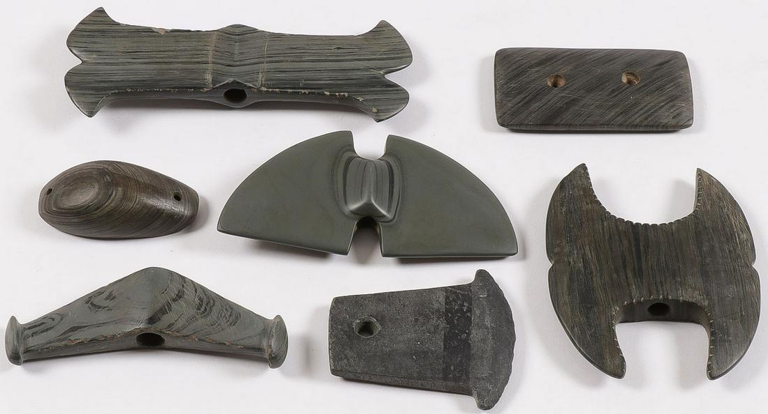 7 SLATE BANNERSTONES: 7 SLATE BANNERSTONES. Comprising seven individual slate bannerstones and one gorget. Various shapes, sizes and in various states of condition, some with rough edges, chips and wear. Presumably post-hi